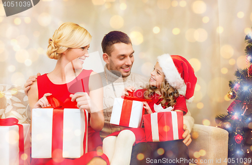 Image of happy family opening gift boxes