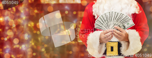 Image of close up of santa claus with dollar money