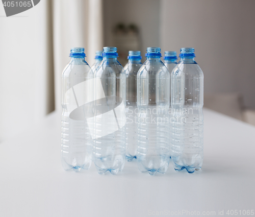 Image of close up of empty used plastic bottles on table