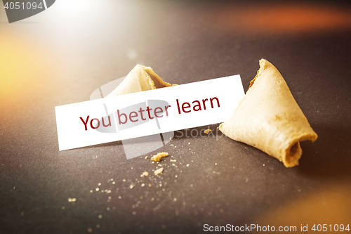 Image of a fortune cookie with message you better learn