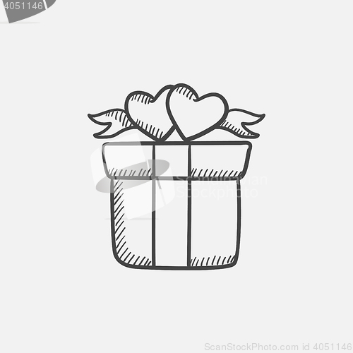 Image of Gift box with hearts sketch icon.