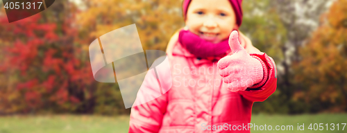 Image of happy girl showing thumbs up over autumn park