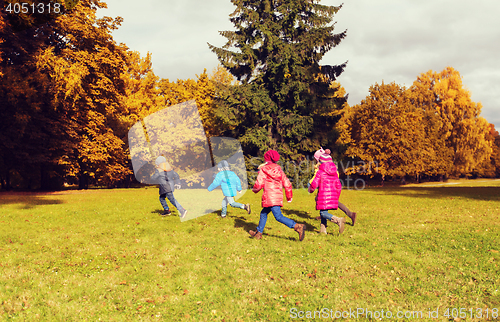 Image of group of happy little kids running outdoors