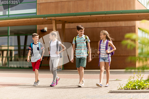 Image of group of happy elementary school students walking