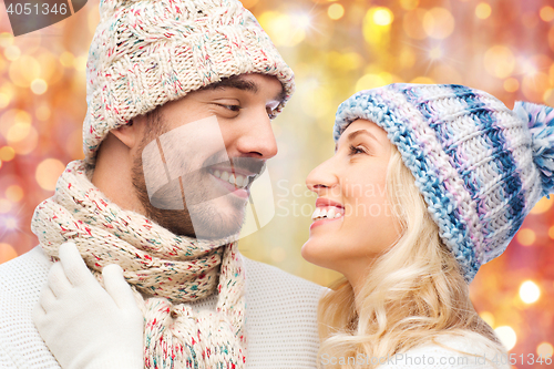 Image of close up of couple in winter clothes hugging