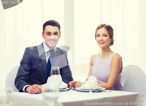 Image of smiling couple at restaurant