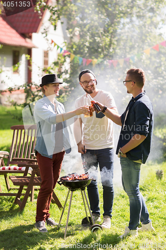 Image of friends drinking beer at summer barbecue party