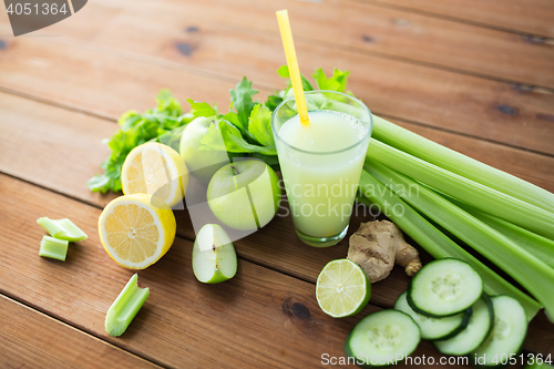 Image of close up of glass with green juice and vegetables