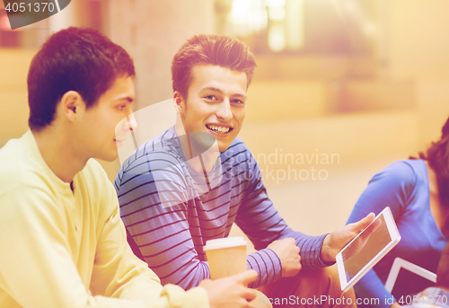 Image of group of students with tablet pc and coffee cup