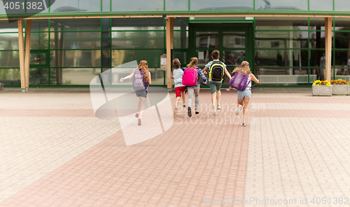 Image of group of happy elementary school students running