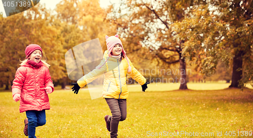 Image of group of happy little girls running outdoors