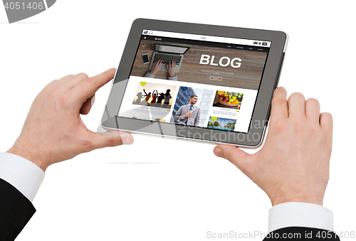 Image of close up of man blogging on tablet pc