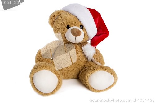 Image of Teddy bear with Santa Claus hat isolated on white background