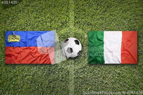 Image of Liechtenstein vs. Italy flags on soccer field