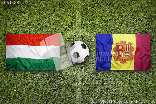 Image of Hungary vs. Andorra flags on soccer field