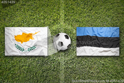 Image of Cyprus vs. Estonia flags on soccer field