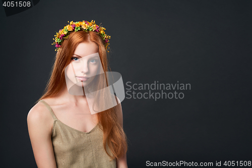 Image of Beautiful red haired woman in flower wreath