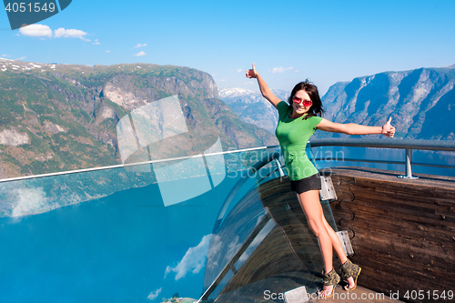 Image of Excited woman tourist at Stegastein Viewpoint