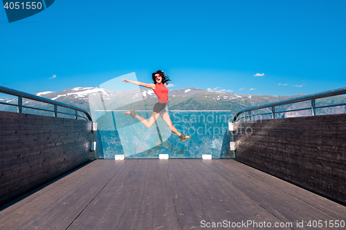 Image of Excited woman tourist at Stegastein Viewpoint