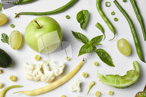 Image of Green vegetables and fruits isolated on white.