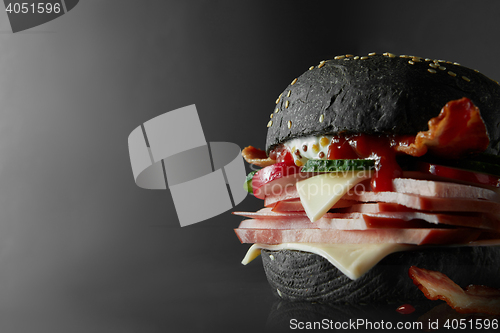 Image of Black Burger with Cheese.