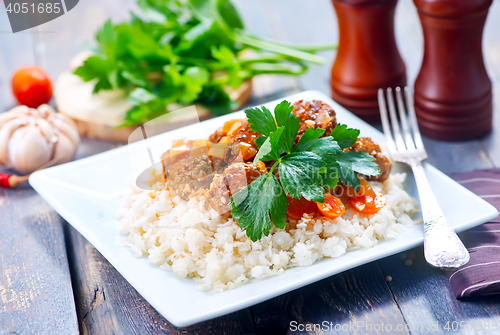 Image of boiled rice with sauce