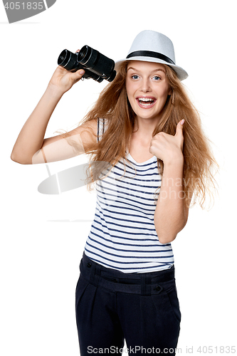 Image of Female with binoculars gesturing thumb up