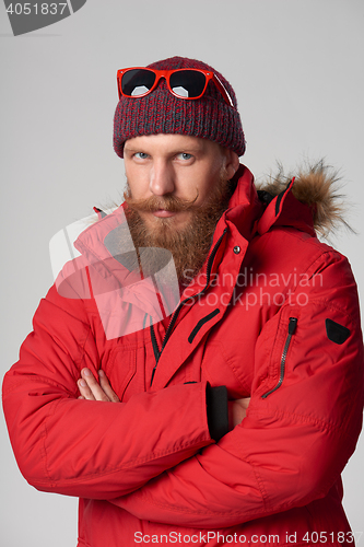 Image of Man wearing red winter jacket
