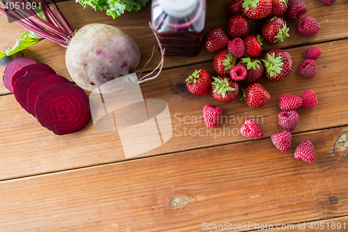 Image of bottle with beetroot juice, fruits and vegetables