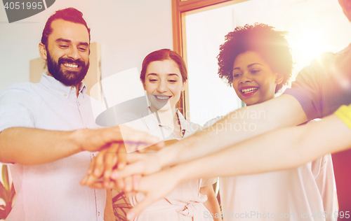 Image of happy creative team in office