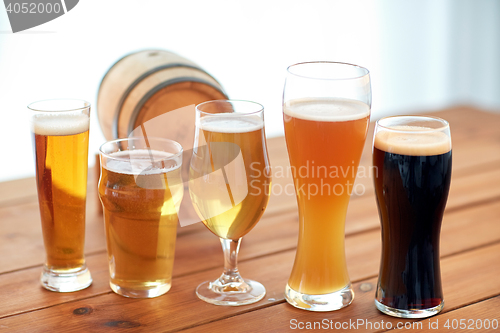 Image of close up of different beers in glasses on table
