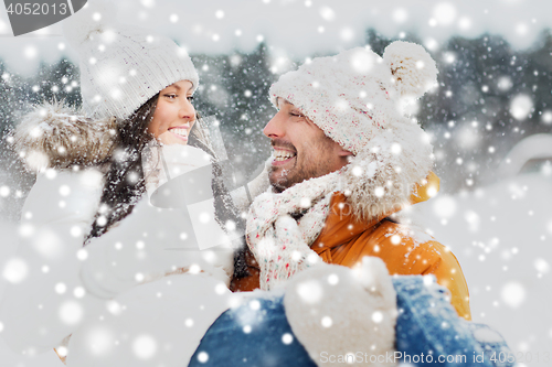 Image of happy couple outdoors in winter
