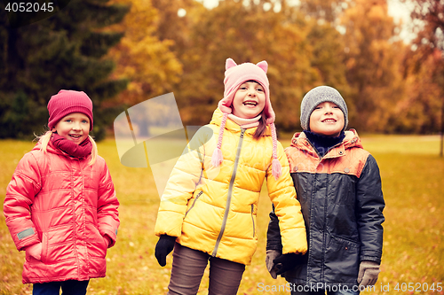 Image of group of happy children in autumn park