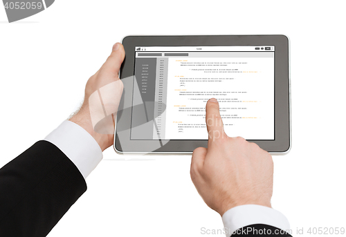 Image of close up of hands holding tablet pc with coding