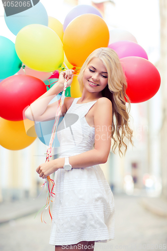 Image of woman with colorful balloons