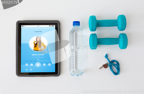 Image of tablet pc, dumbbells, whistle and water bottle