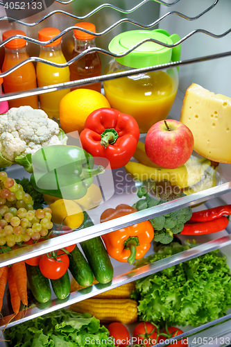 Image of Open refrigerator filled with food