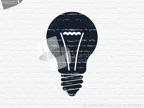 Image of Finance concept: Light Bulb on wall background