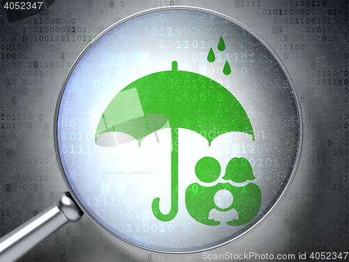Image of Security concept: Family And Umbrella with optical glass on digital background