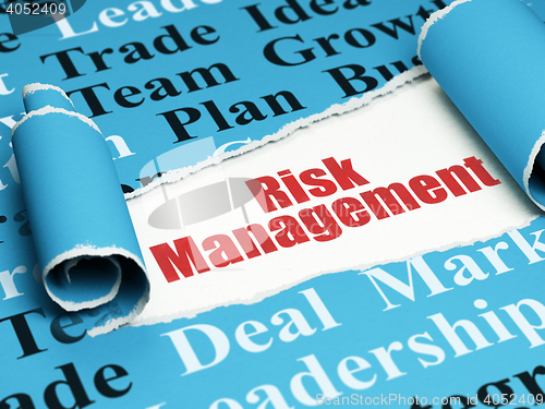 Image of Finance concept: red text Risk Management under the piece of  torn paper