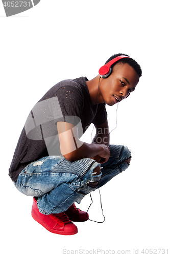 Image of Handsome teenager listening to music
