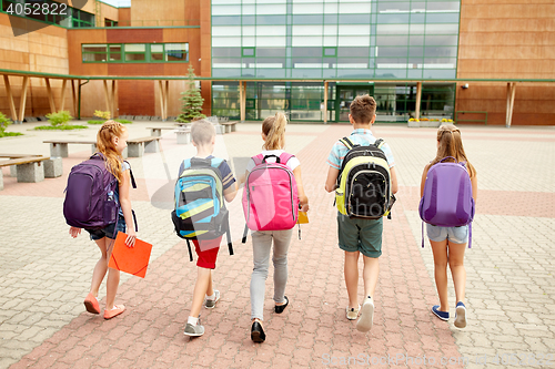 Image of group of happy elementary school students walking