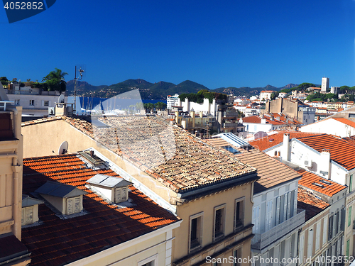 Image of  rooftop view Cannes France old town fort in background   