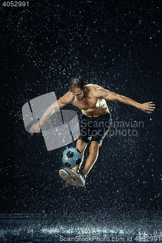 Image of Water drops around football player