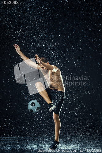 Image of Water drops around football player