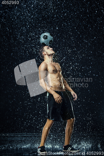 Image of Water drops around football player