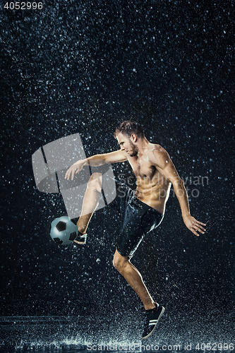 Image of Water drops around football player