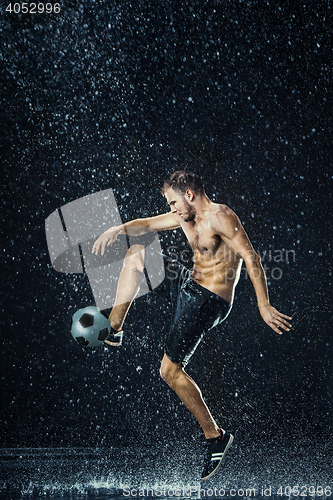 Image of Water drops around football player