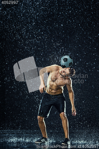 Image of Water drops around football player