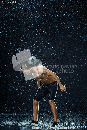 Image of Water drops around football player